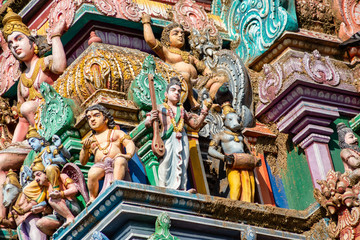Hindu temple in Tamil Nadu, South India.  Sculptures on Hindu temple gopura (tower), sculpture of an Indian deity