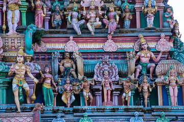 Hindu temple in Tamil Nadu, South India.  Sculptures on Hindu temple gopura (tower)
