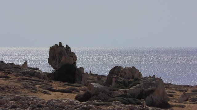 Stones on the shores of the Mediterranean Sea in the Park Royal Tombs in Paphos.