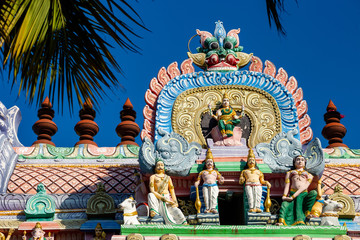 Hindu temple in Tamil Nadu, South India.  Sculptures on Hindu temple gopura (tower)
