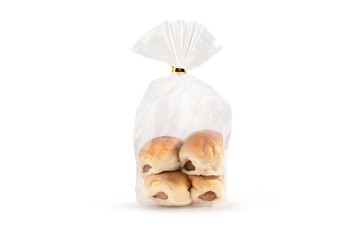 Obraz na płótnie Canvas Bread with sausage in plastic bag on white background and clipping path for using
