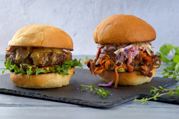 hamburger with bacon and sauce and Burger with pulled pork