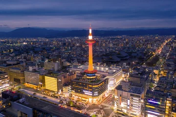 Fotobehang drone view of Kyoto tower near Kyoto railway station in the night © Chenxiaoyang