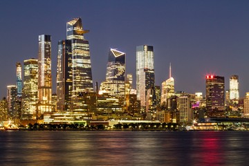 Fototapeta na wymiar Beautiful view of New York city skyline with waterfront at night, USA