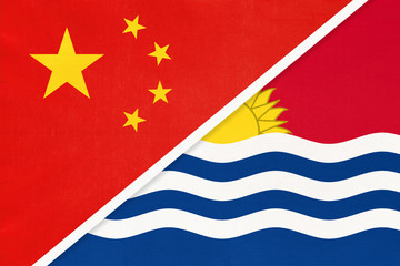 China or PRC vs Kiribati national flag from textile. Relationship between Asian and Oceania countries.