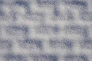 The image of snow on paving slabs.