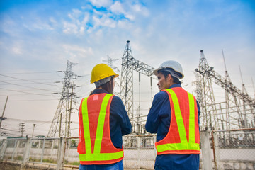 Two Engineer standing at power plant factory system