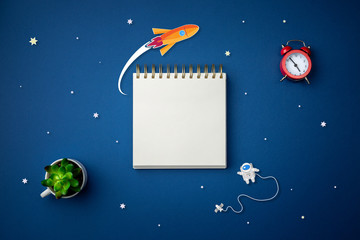 blue background with astronaut, stars and rocket