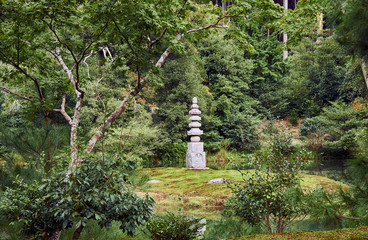 White Snake Pagoda on the islet on the Anmin-taku pond. Kinkaku-ji temple. Kyoto. Japan
