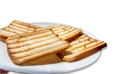 Toasted sliced bread, seasoned with olive oil
