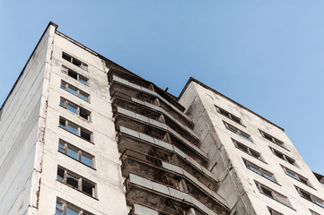 Looking up at an abandoned apartment skyscraper in Pripyat, Chernobyl Exclusion Zone