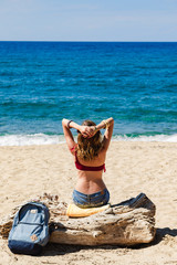 Woman enjoying on a sandy tropical beach.