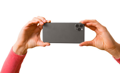 Person holding in hands mobile phone and taking picture, photo isolated on white background
