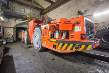 LHD load haul dumper machine toro truck in gold mine underground tunnel