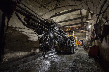 Underground gold mine tunnel with drilling machine
