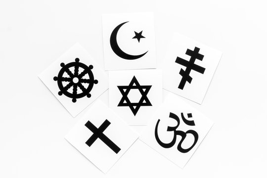 World religions concept. Christianity, Catholicism, Buddhism, Judaism, Islam symbols on white background top view