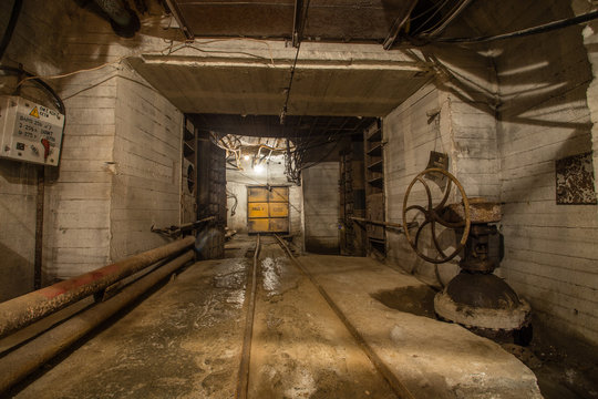 Underground magnesite ore mine tunnel with waterproof gates