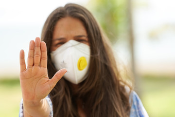 Beautiful Woman using a n95 mask preventing the Covid19 - coronavirus