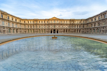 Fountain in the middle of an empty square court or 