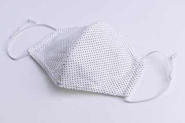 design of face mask handmade sewing from fashion fabric cotton cloth on white background