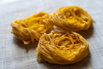Italian uncooked dry pasta Tagliatelle