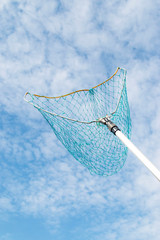 large net of threads against the sky