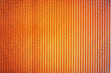 Orange background with abstract pattern stripes.