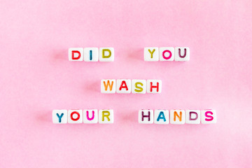 Phrase Did You Wash Your Hands from colorful beads on pink background, hygiene concept