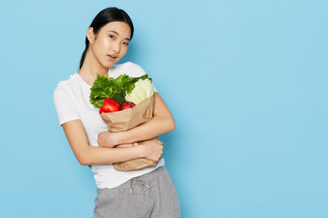 young woman holding a bunch of flowers