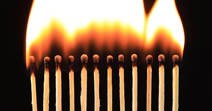 Burning matches concept. Ignition matches in sequence, metaphor of influence, chain reaction, domino effect.
