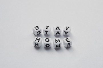 Stay Home written with word cubes, Stop Corona Virus, Mock up with no people and space for Text
