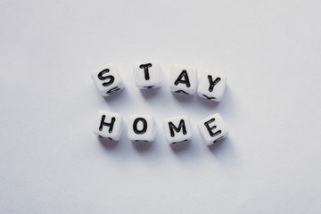 Stay Home written with word cubes, Stop Corona Virus, Mock up with no people and space for Text
