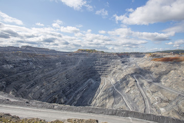 Magnezite ore quarry open pit mine at summer day