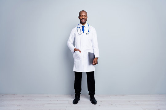 Full length photo of doctor intern dark skin guy good mood friendly smiling patients virology department test papers wear white lab coat neck tie isolated grey color background