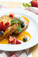 Toast with cream, strawberry and milk souse. Sweet breackfast