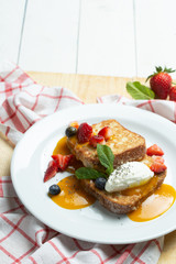 Toast with cream, strawberry and milk souse. Sweet breackfast