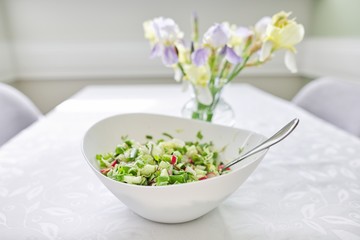 Homemade spring vegetable salad with radish and cucumber cabbage