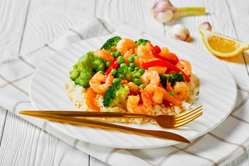 close-up of fried shrimps with veggies and rice