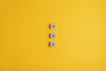 Three wooden blocks reading a www sign