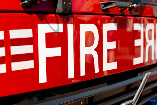 Close up of FIRE sign on the front of a British fire engine.
