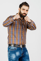 Middle-aged man in faded jeans and shirt on white background showing different emotions
