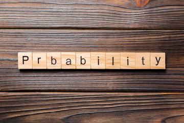 probability word written on wood block. probability text on table, concept