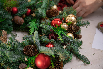 Obraz na płótnie Canvas blank for Christmas wreath of spruce and cypress. instructions for making a Christmas wreath. Christmas wreath workshop. Decorating a wreath with New Year's toys. Christmas decoration