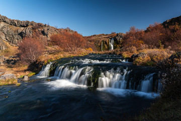 Gjain scenic valley with waterfalls and ponds in Iceland