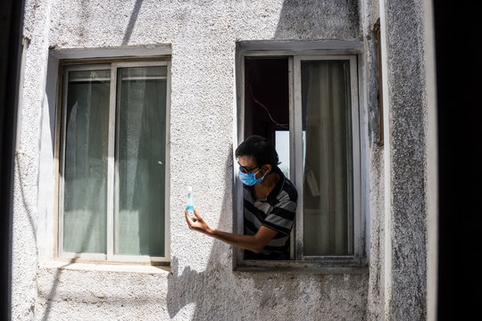 Man with mask stucked at home due to corona virus lockdown