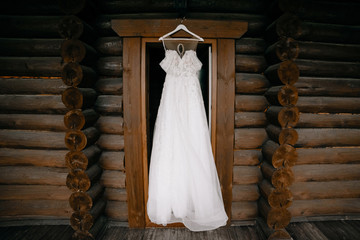 composition - wedding dress on a wood wall