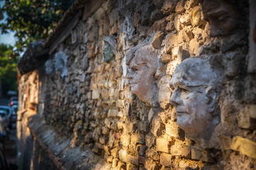 Clay busts on wall in Rome