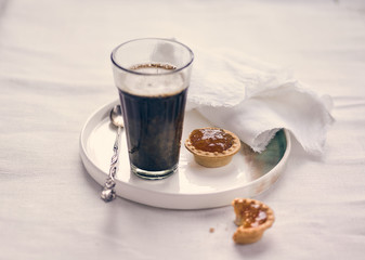 glass of coffee and canapes