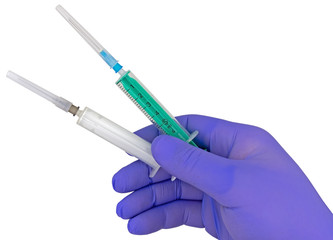 Plastic syringes and needle in hand in medical glove