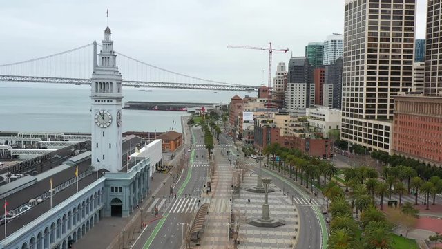Aerial clip flying over the san francisco embarcadero during the April 2020 covid-19 coronavirus pandemic quarantine 